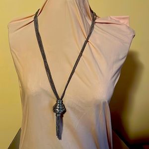 Unique large silver tone knot tassel necklace